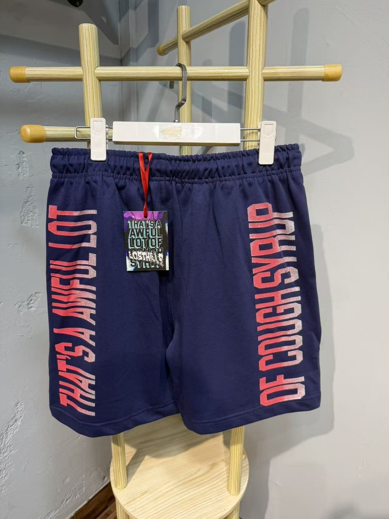 THAT'S A AWFUL LOT OF COUGH SYRUP Navy Graphic Shorts — back