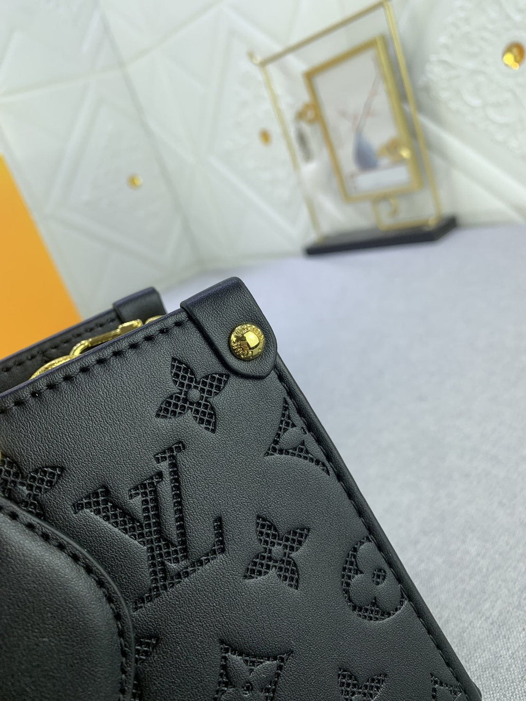 Louis Vuitton OnTheGo East West Embossed Leather Handbag — detail