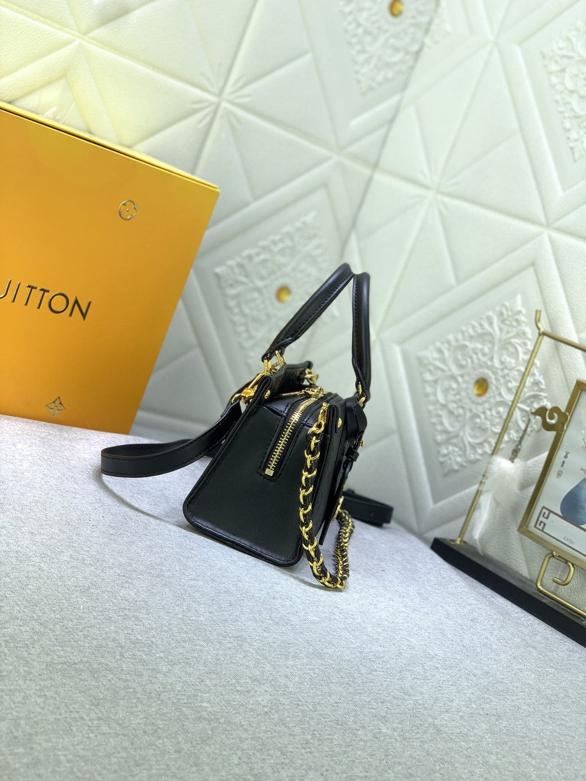 Louis Vuitton OnTheGo East West Embossed Leather Handbag — side