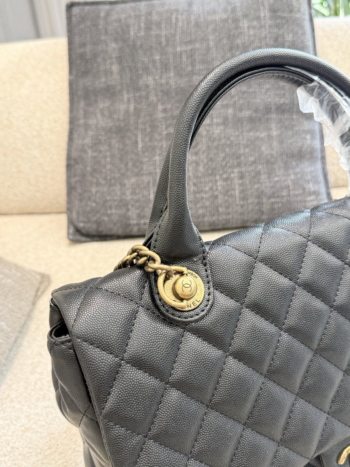 Chanel Diamond-Quilted Top-Handle Flap Bag — detail