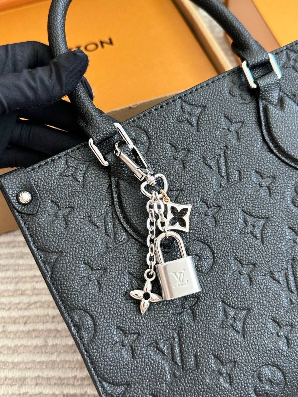 Louis Vuitton Onthego Black Embossed Tote — detail
