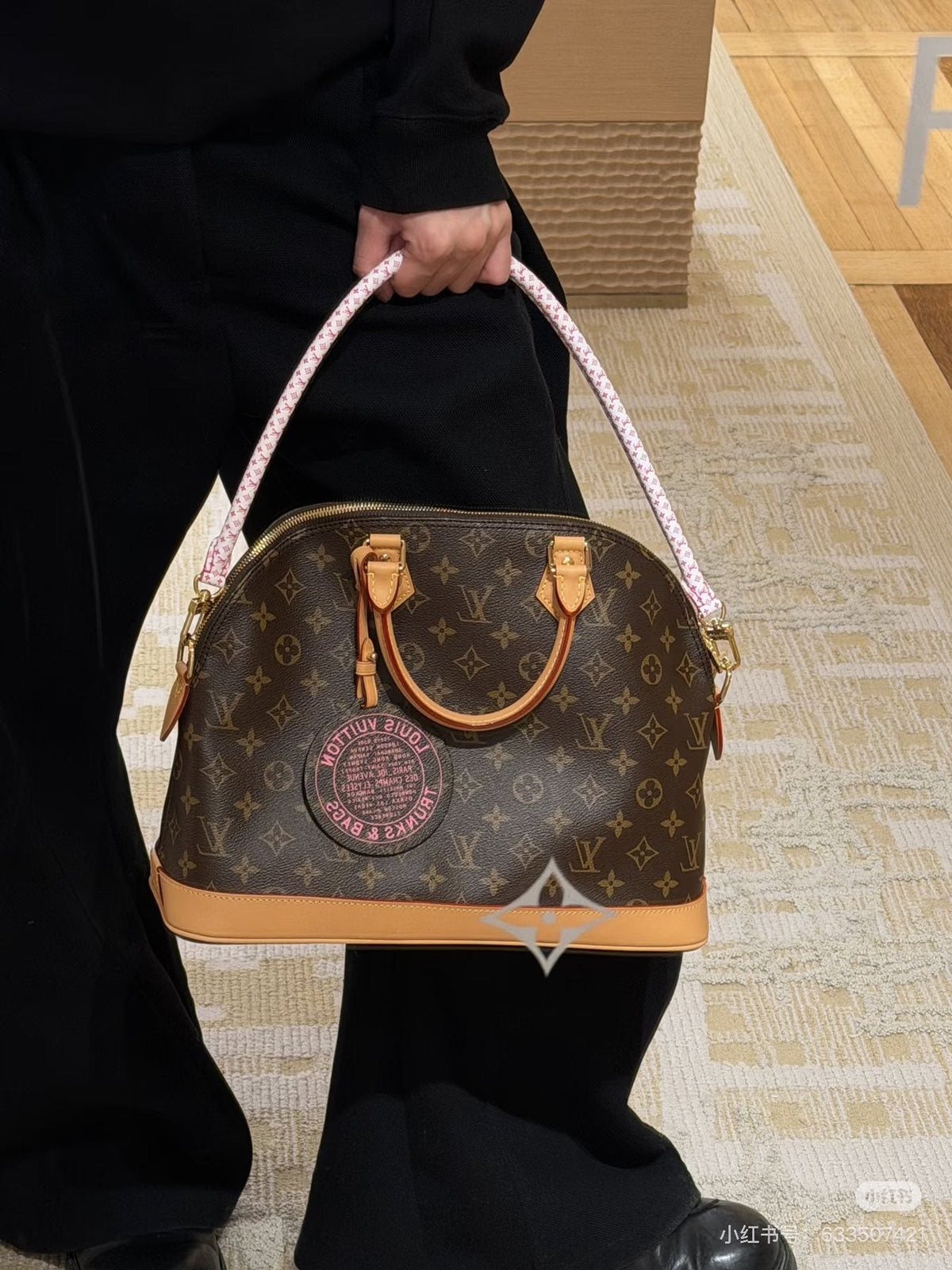 Louis Vuitton Alma Monogram Handbag with Pink Strap — model