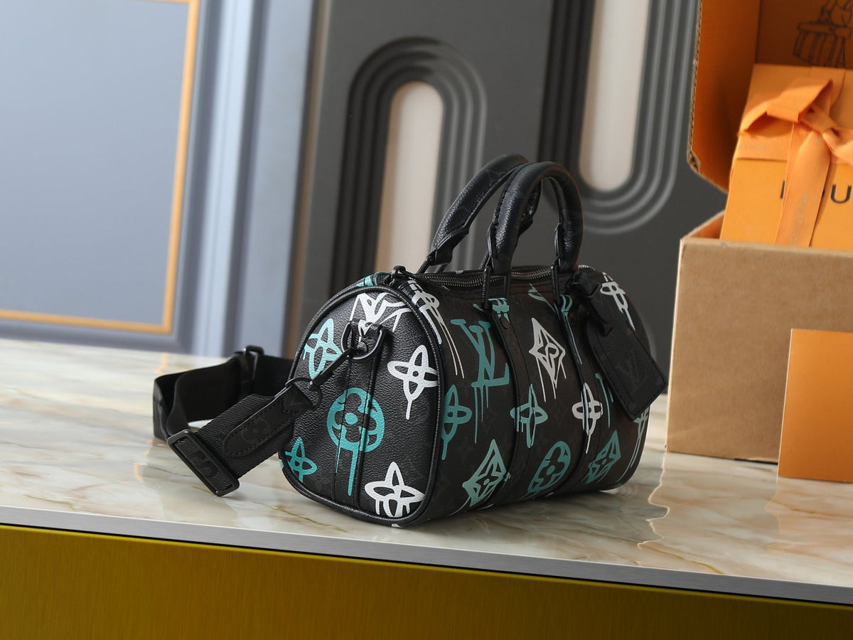Louis Vuitton Keepall Bandoulière Duffel Bag — side