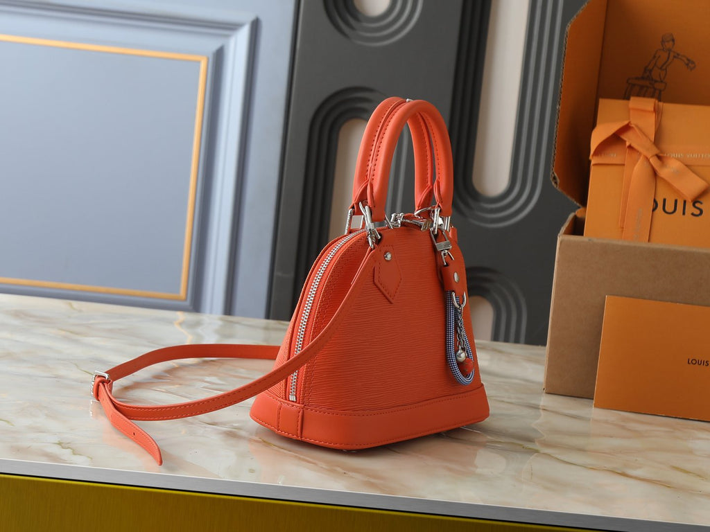 Louis Vuitton Alma BB Domed Top-Handle Bag — side