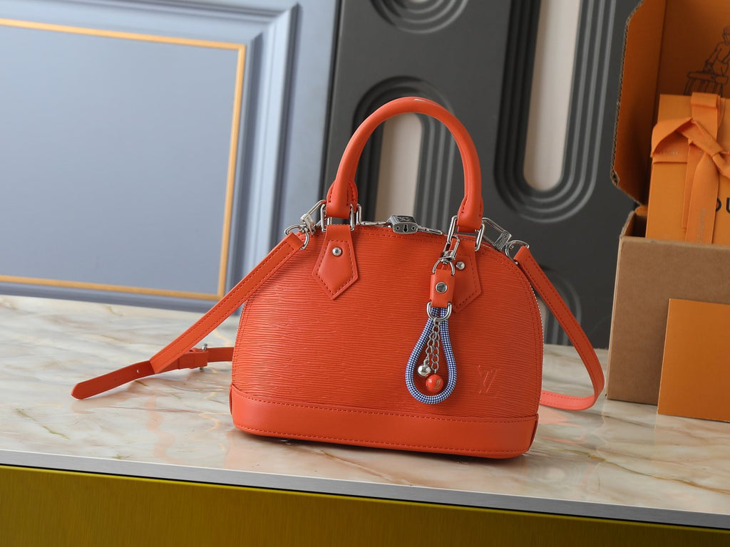 Louis Vuitton Alma BB Domed Top-Handle Bag — hero