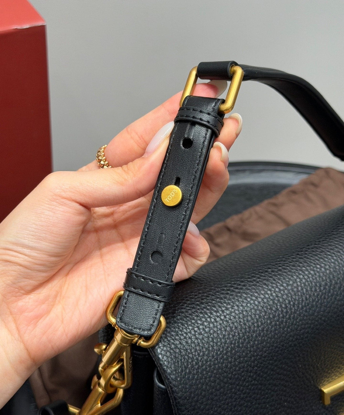 Tod's Black Accordion Flap Shoulder Bag — detail