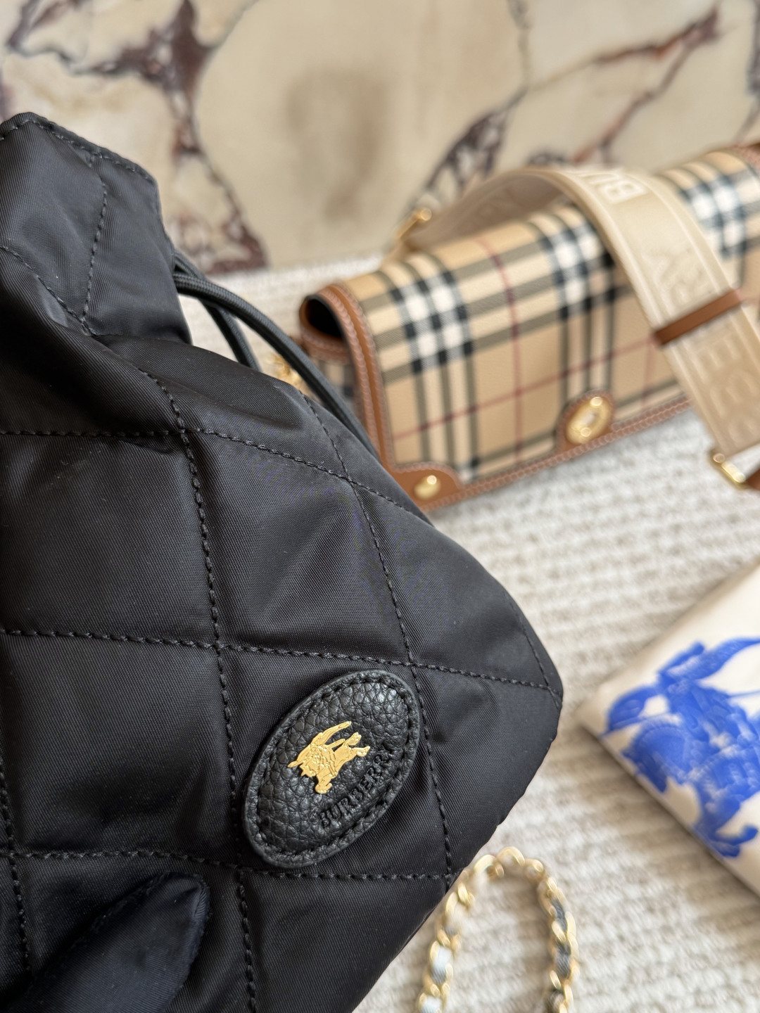 Black Quilted Chain-Strap Bucket Bag — detail