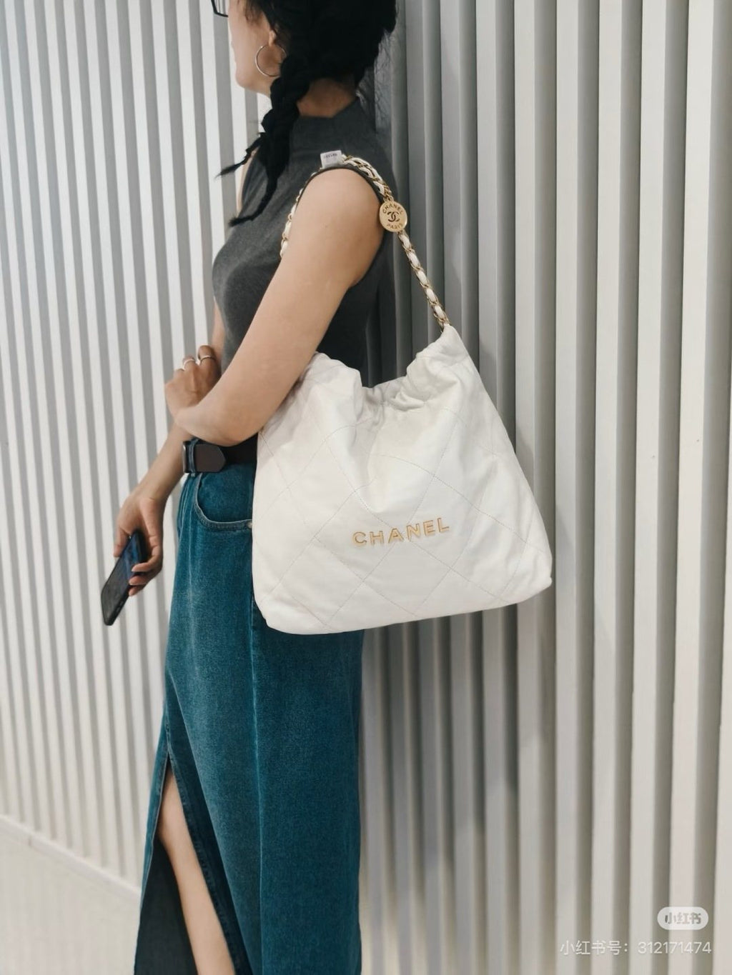 Chanel 22 Quilted Chain Shoulder Bag — model