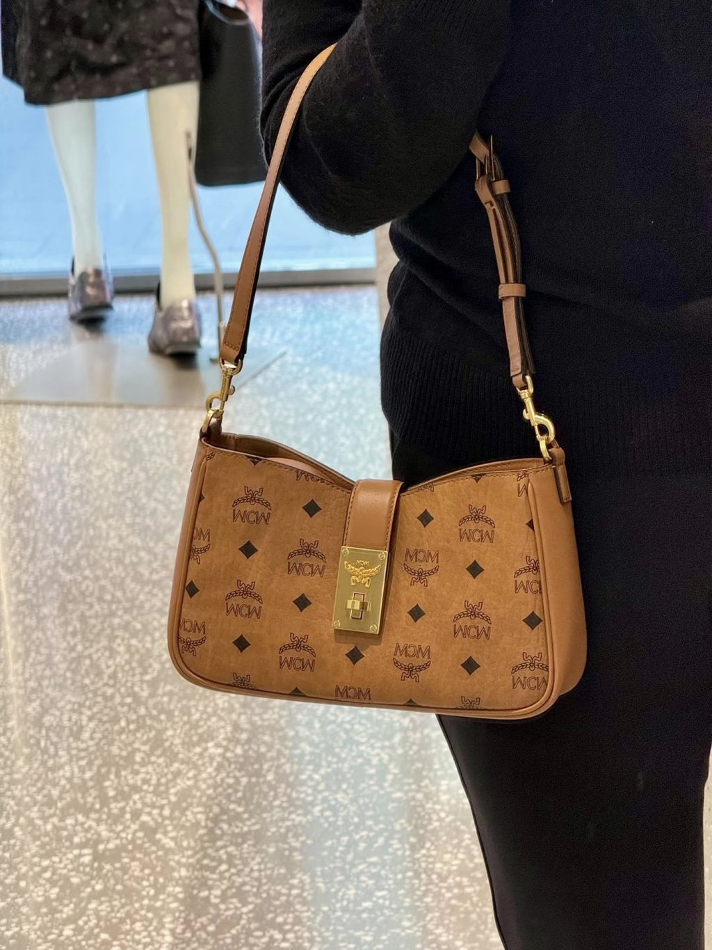 MCM Monogram Hobo Bag with Gold-Tone Clasp — model