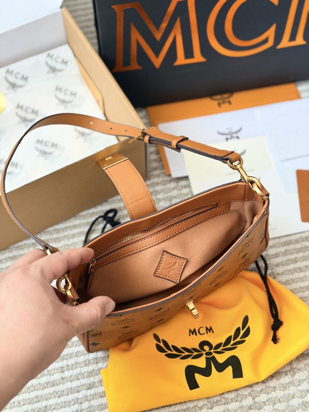 MCM Monogram Hobo Bag with Gold-Tone Clasp — front