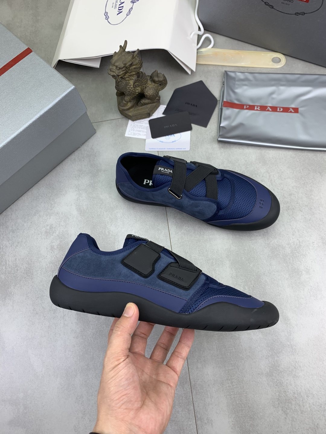 Prada Cross-Strap Low-Top Sneakers — model