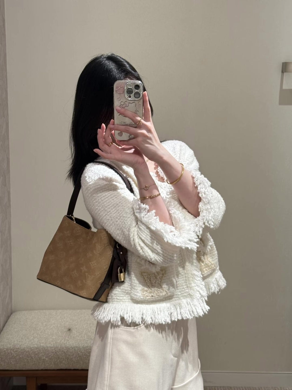 Louis Vuitton Tan Embossed Monogram Bucket Bag — model