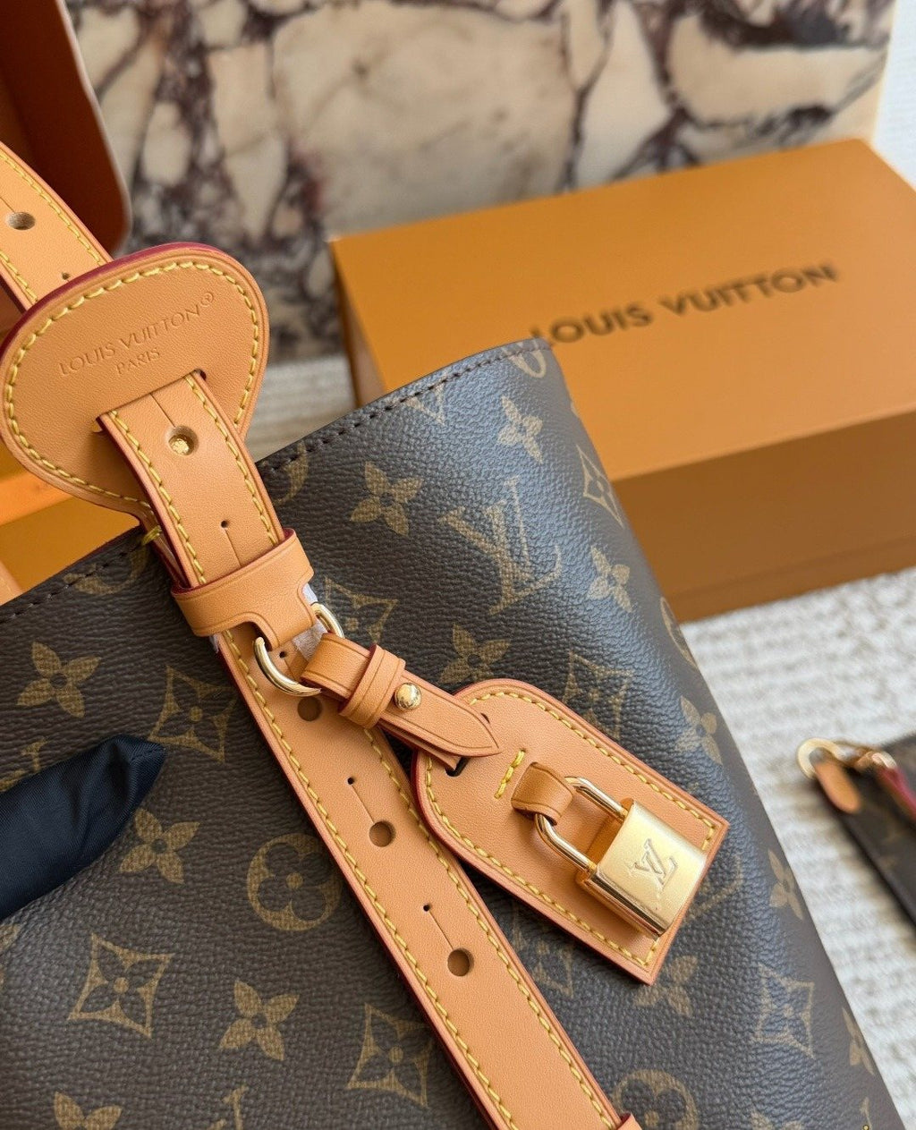 Louis Vuitton Monogram Buckle-Strap Bucket Bag — detail