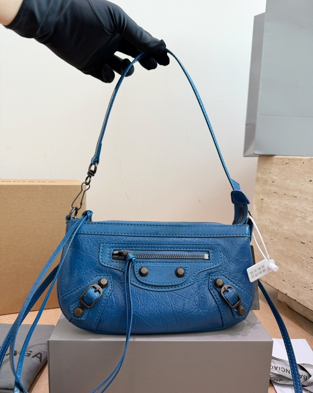 Balenciaga Studded Shoulder Bag with Long Zipper Ties — model
